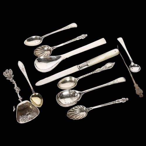 1014 - A quantity of English and Continental silver teaspoons, a Dutch silver spoon, a mother-of-pearl hand... 