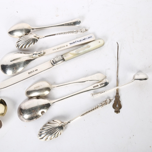 1014 - A quantity of English and Continental silver teaspoons, a Dutch silver spoon, a mother-of-pearl hand... 