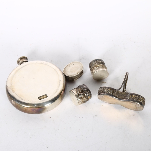 1019 - A small oval cherub embossed silver pill pot, a silver plated hunting hip flask, and a miniature sil... 