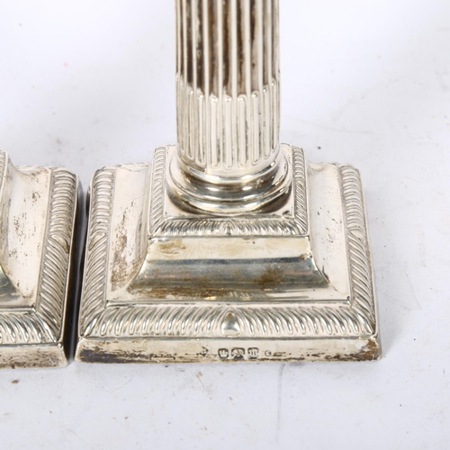 1028 - A pair of George V silver Corinthian column candlesticks, on stepped plinth bases, H15cm, hallmarks ... 