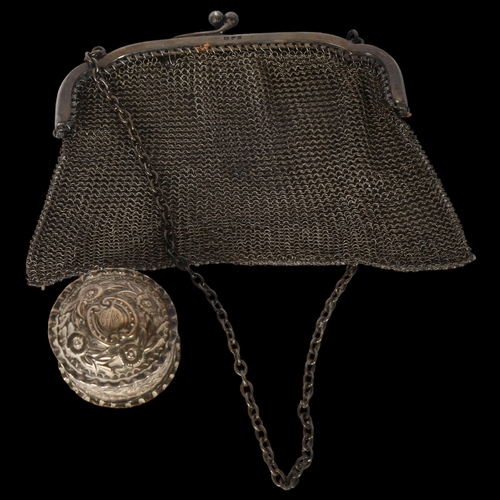 1034 - A George V silver mesh evening purse, hallmarks for London 1919, 3.6oz, and a circular relief emboss... 