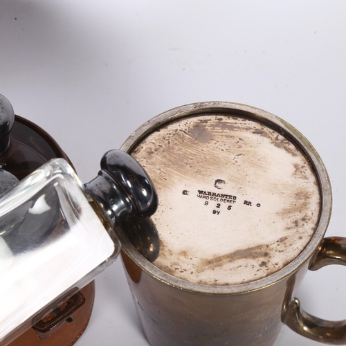 910 - A silver plated tankard, and a leather-cased travelling set comprising 3 bottles with plated lids (2... 