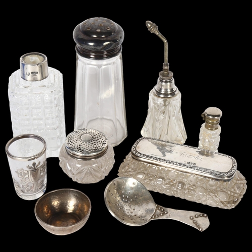 918 - A group of silver-topped dressing table bottles, and sugar sifter etc