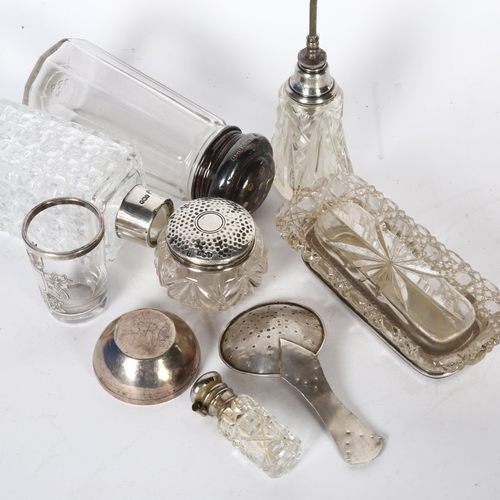 918 - A group of silver-topped dressing table bottles, and sugar sifter etc