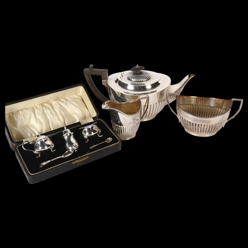 922 - A silver plated 3-piece tea set of half-fluted form, and a 3-piece silver plated cruet set, cased