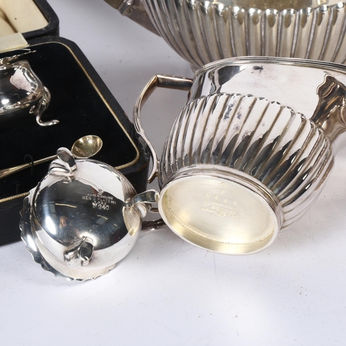 922 - A silver plated 3-piece tea set of half-fluted form, and a 3-piece silver plated cruet set, cased