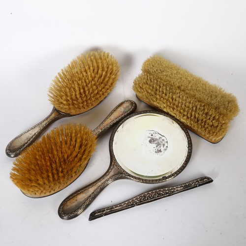 925 - A George V silver-backed 5-piece dressing table brush and mirror set, with swag embossed decoration,... 