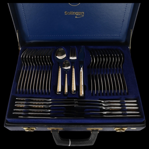 926 - A Jager Solingen 24ct gold plated and stainless steel canteen of cutlery for 12 people, in fitted ca... 