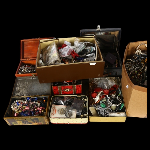 931 - A large quantity of mixed costume jewellery (8 tins and boxes)