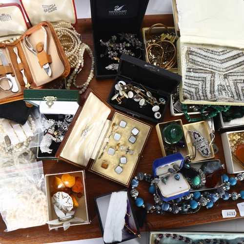 932 - A tray of various costume jewellery, including pearl necklaces, early 20th century beadwork purse, m... 