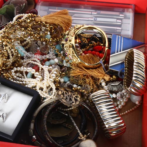 935 - A tray of mixed costume jewellery, bangles, badges, a box of various wristwatches, plated cutlery (2... 