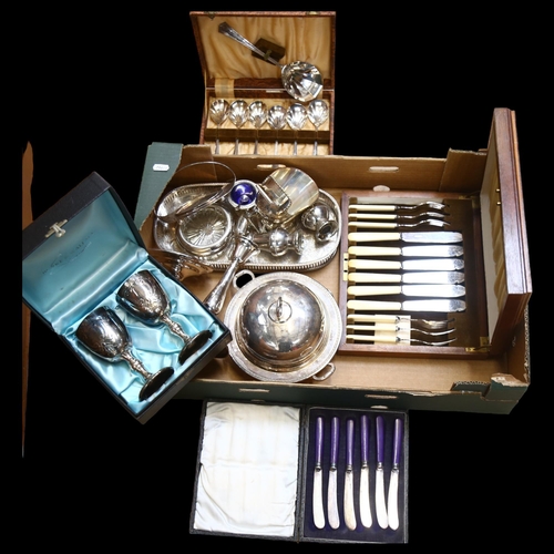 950 - A silver plated muffin dish and cover, cased cutlery, pair of electroplate on copper candlesticks et... 