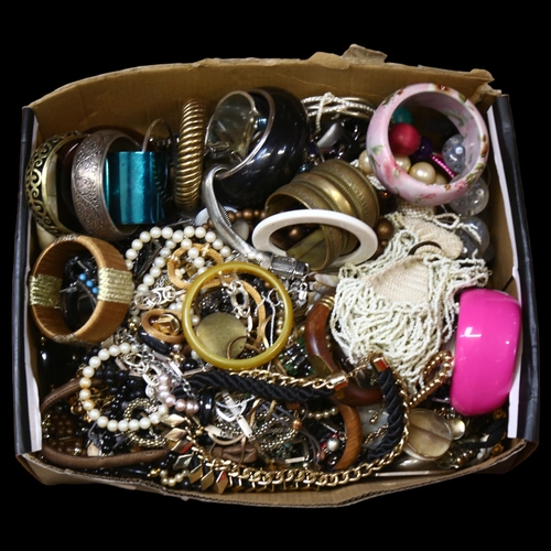 952 - A large collection of modern costume bangles, necklaces etc