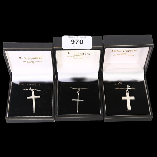 970 - 3 silver chains and crucifixes, boxed