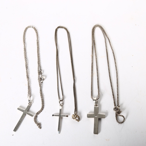 970 - 3 silver chains and crucifixes, boxed