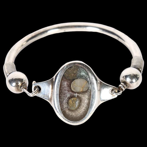 972 - A Scandinavian stone torque bangle, unmarked silver settings, panel length 31.9mm