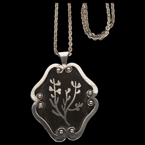 974 - A Swedish hardwood and silver-mounted floral pendant, on a silver chain, L51.8mm