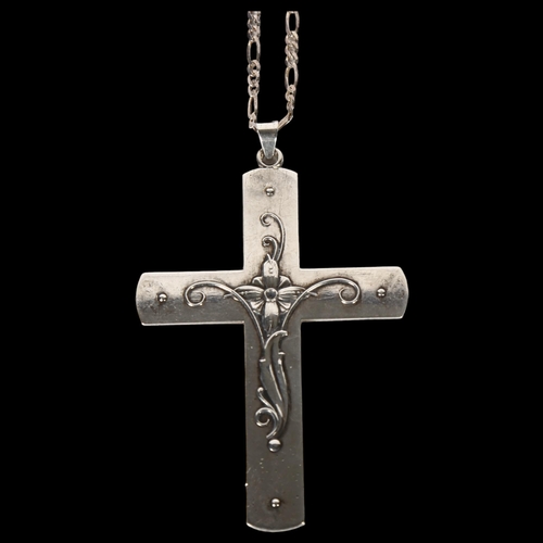 977 - A large embossed silver crucifix and chain