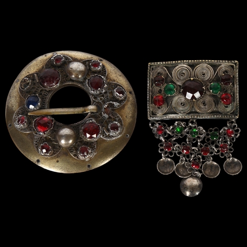 979 - 2 Scandinavian stone set Folk Art brooches, in unmarked white metal settings, widest 60mm