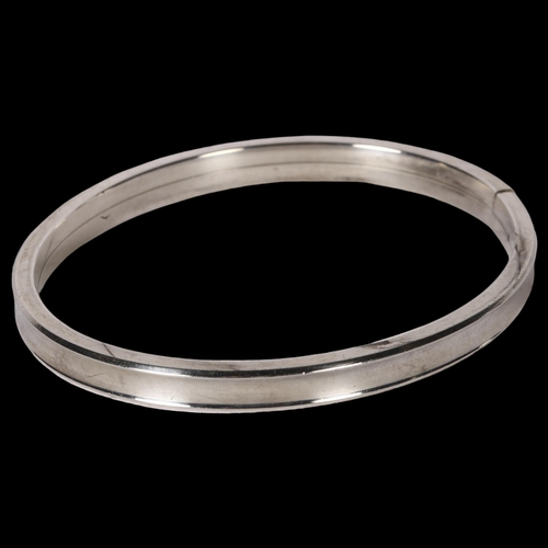 983 - C H R WEILSKOV, COPENHAGEN - oval silver bangle of plain form, overall diameter 68mm