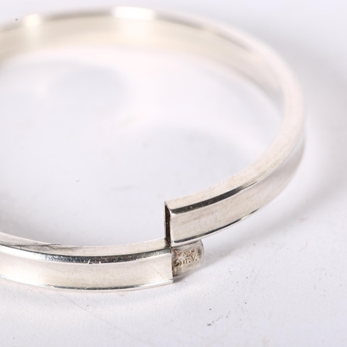 983 - C H R WEILSKOV, COPENHAGEN - oval silver bangle of plain form, overall diameter 68mm