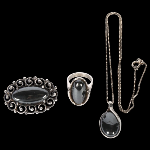 990 - HANS HENRICH NYGAARD - a sterling silver and hematite ring, pendant and brooch