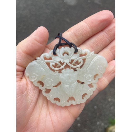 1249 - A large Chinese white jade butterfly amulet pendant, pierced and carved double-sided decoration, win... 