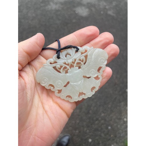 1249 - A large Chinese white jade butterfly amulet pendant, pierced and carved double-sided decoration, win... 