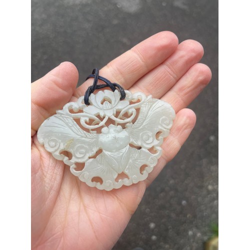 1249 - A large Chinese white jade butterfly amulet pendant, pierced and carved double-sided decoration, win... 