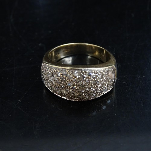 1023 - A 9ct gold and diamond panel set ring, 6.8g, ring size N