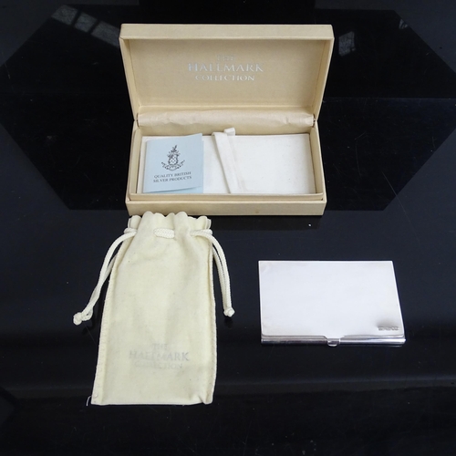 1030 - A Queen Elizabeth II silver card case in new condition, from the Hallmark Collection, in original fi... 