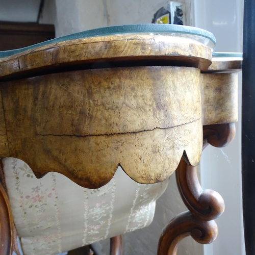 2109 - An antique walnut and burr walnut veneered workbox of shaped form, with satinwood inlay. Lifting lid... 