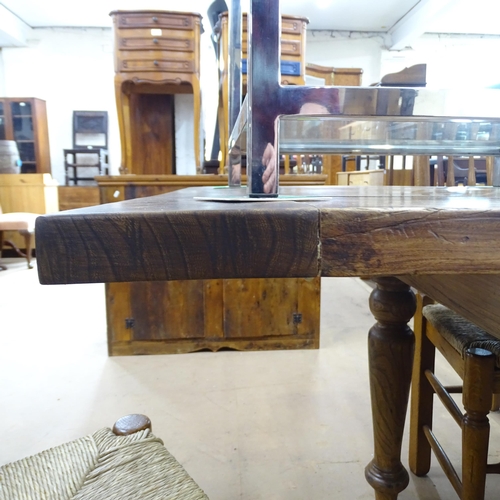 2167 - A large and impressive solid elm plank top farmhouse kitchen table with breadboard ends on turned le... 