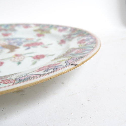 192 - A pair of famille rose Chinese plates, diameter 23cm