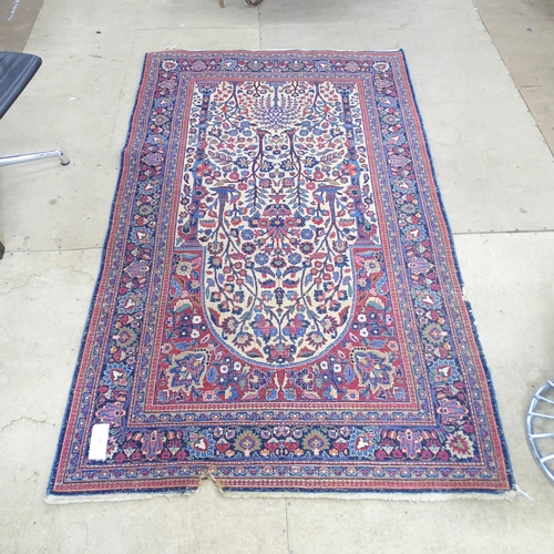 2311 - A blue and red-ground Persian prayer rug. 216x130cm