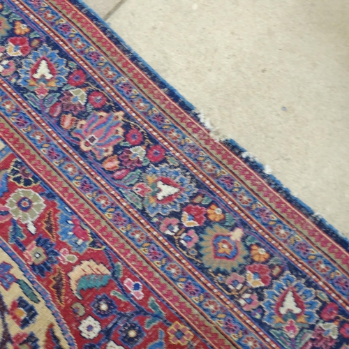 2311 - A blue and red-ground Persian prayer rug. 216x130cm