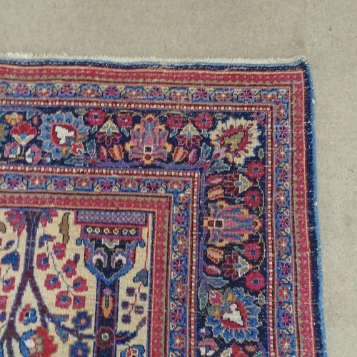 2311 - A blue and red-ground Persian prayer rug. 216x130cm