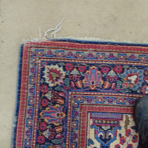 2311 - A blue and red-ground Persian prayer rug. 216x130cm