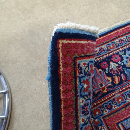 2313 - A blue and red ground Persian prayer rug. 220x130cm