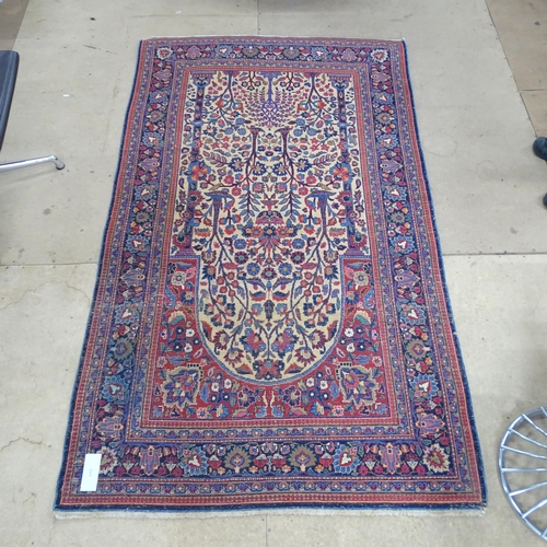 2313 - A blue and red ground Persian prayer rug. 220x130cm