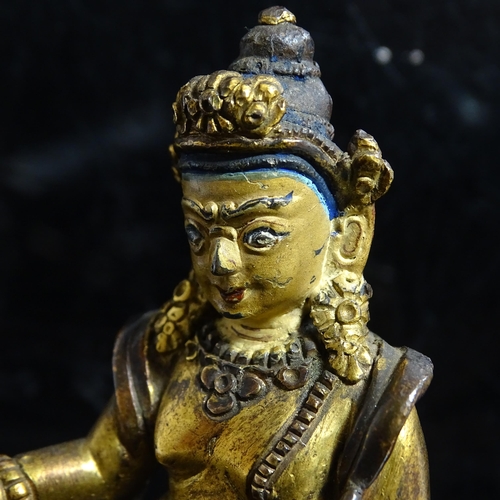 123 - A small Tibetan patinated bronze Jambhala, H9cm