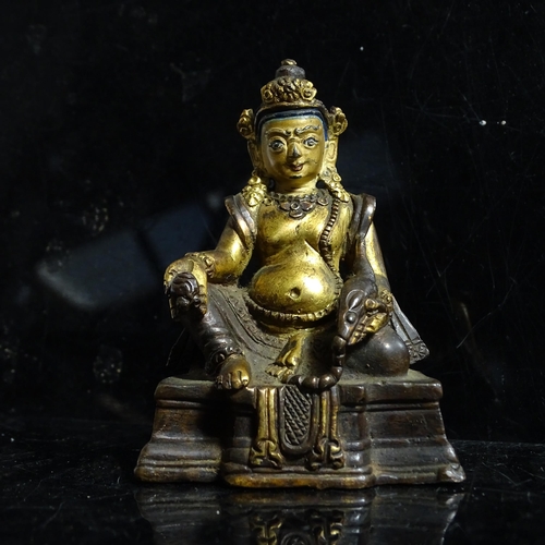 123 - A small Tibetan patinated bronze Jambhala, H9cm