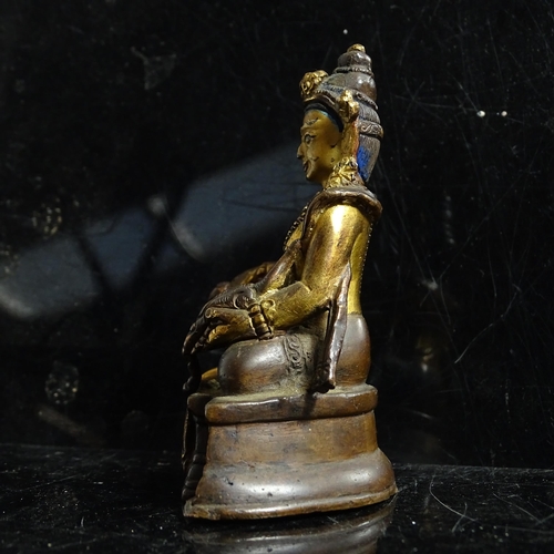 123 - A small Tibetan patinated bronze Jambhala, H9cm