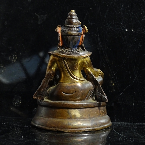 123 - A small Tibetan patinated bronze Jambhala, H9cm