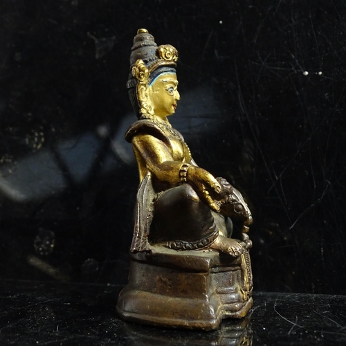 123 - A small Tibetan patinated bronze Jambhala, H9cm