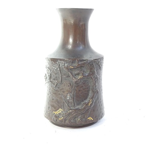 104 - A Japanese bronze vase with relief tree and gilt decoration in mallet form, height 15cm