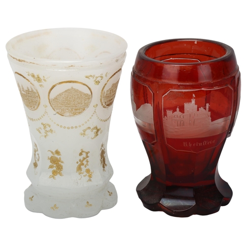 11 - 2 pieces of Bohemian glass, comprising a ruby overlay goblet with panels depicting German palaces, h... 