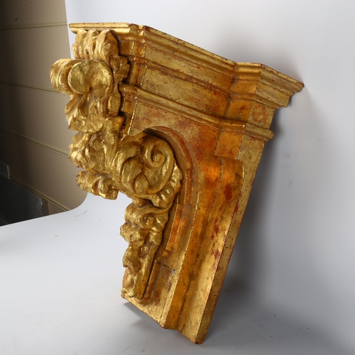 136 - An ornate carved giltwood wall bracket, probably early 20th century, height 46cm, width 38cm