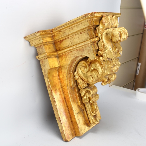 136 - An ornate carved giltwood wall bracket, probably early 20th century, height 46cm, width 38cm