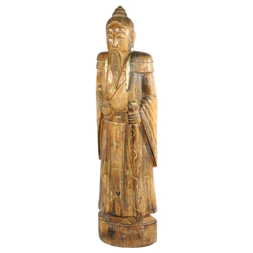 145 - A large floor standing carved and gilded wood Chinese standing Sage figure, height 119cm (3'11